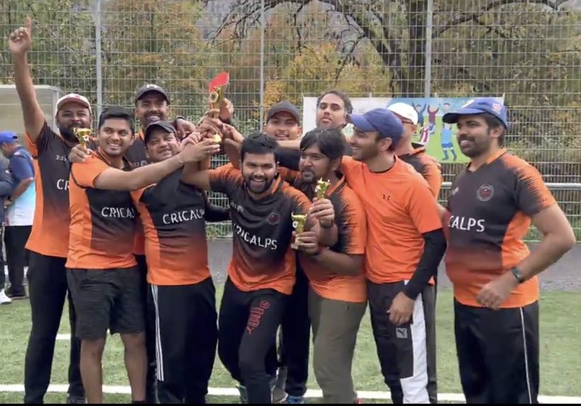 The orange-kitted side lifting a trophy together on the field