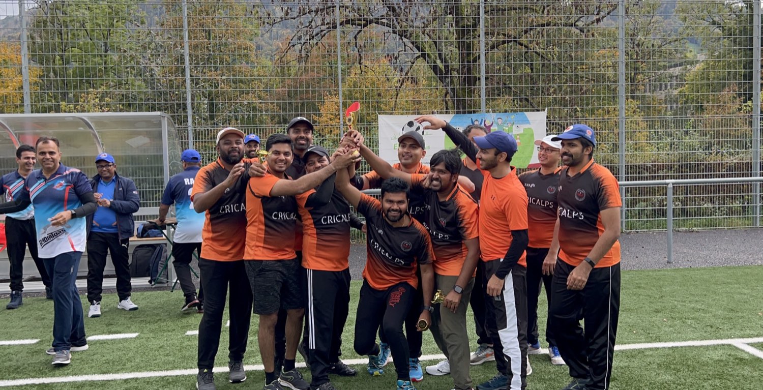 The team lifting a trophy together after a tournament final